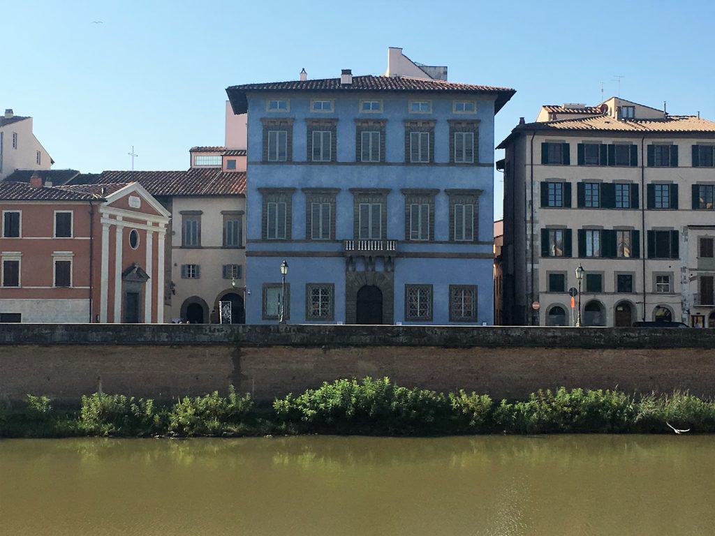 One day in Pisa: Brightly coloured buildings along the River Arno