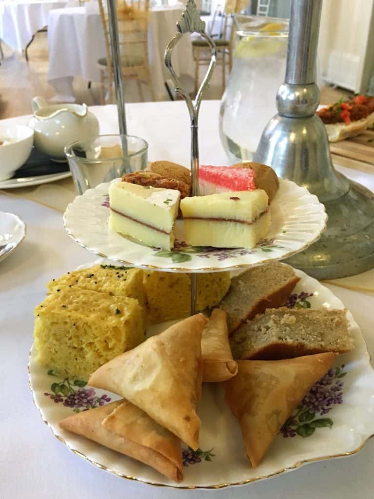 Cake stand with samosas, dhokra and mithai