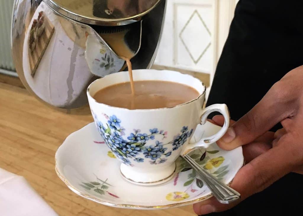 Indian afternoon tea: Masala chai being poured