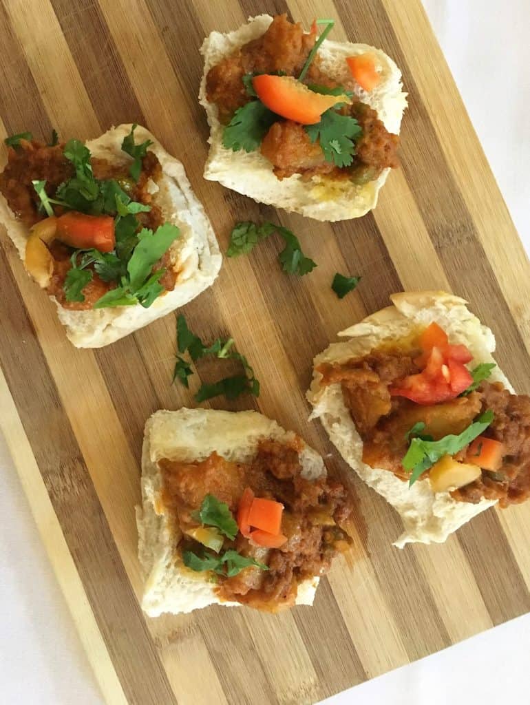 Wooden board with open pau bhaji