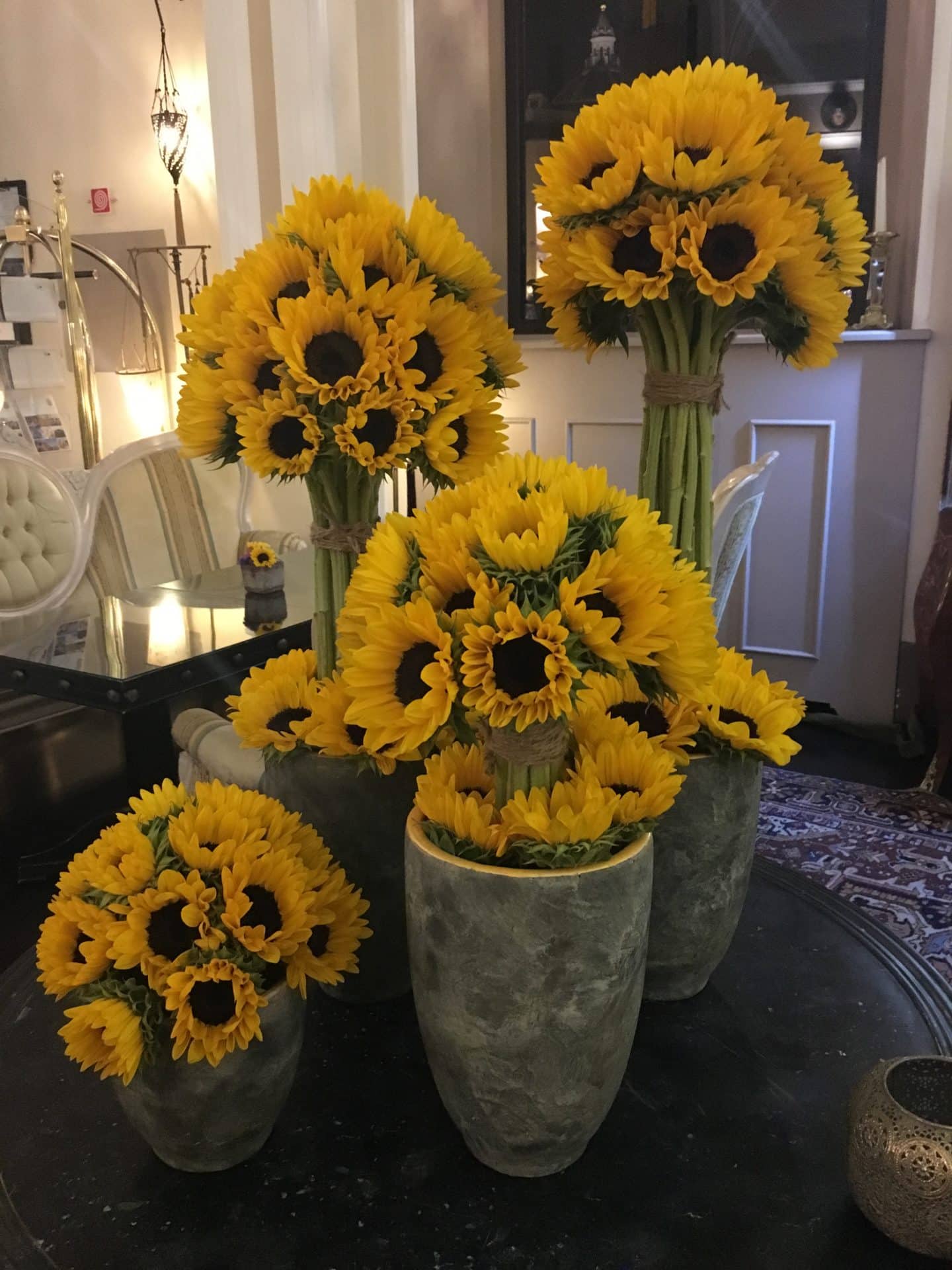 The Opulent Bernini Palace Hotel sunflowers in lobby. 5 vases in the hotel lobby with large bunches of sunflower arrangements.
