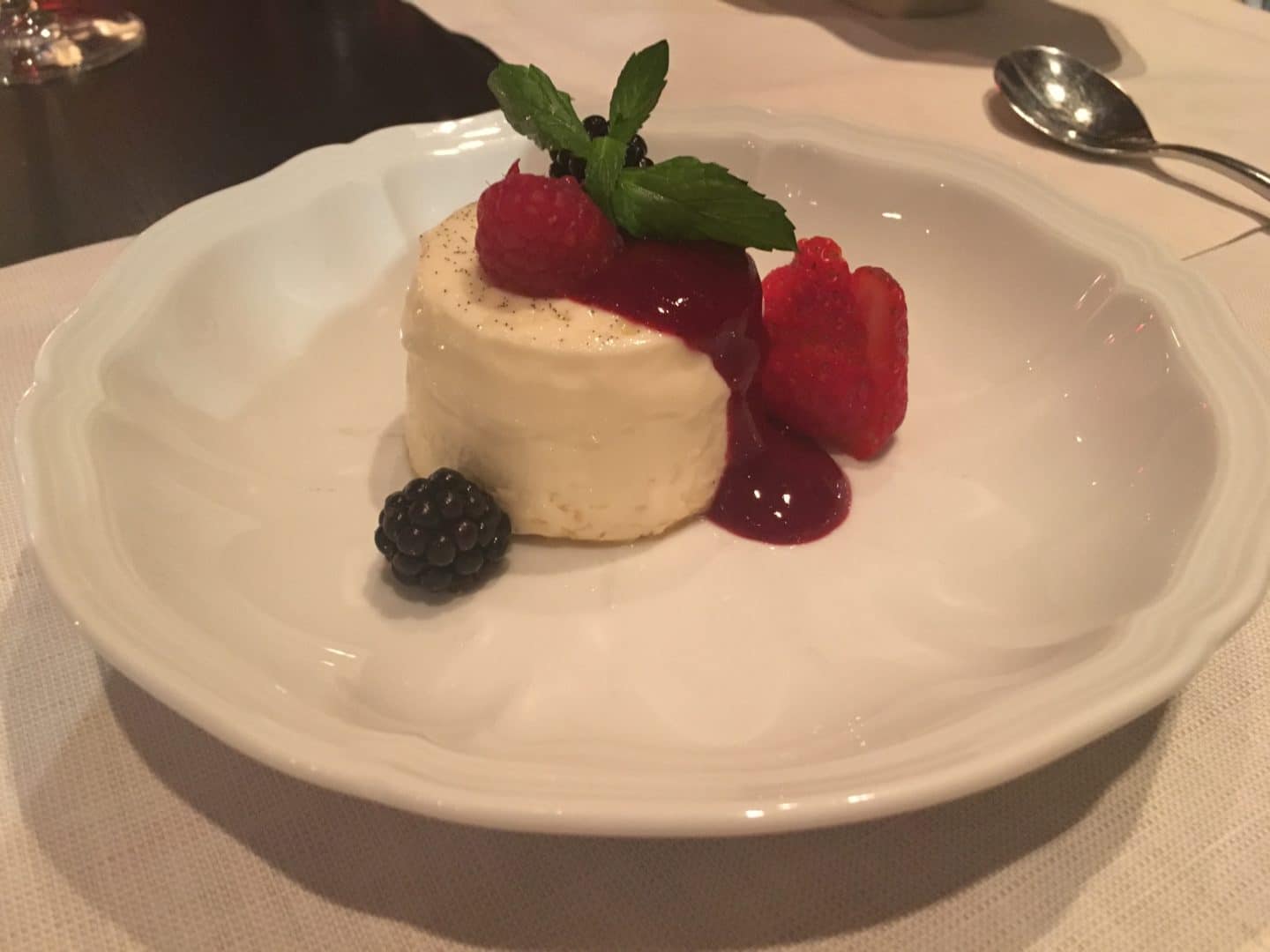 La vera panna cotta Panna cotta...the real recipe: flavored with fresh vanilla pod, seasonal fresh fruit sauce (gelatin-free) at Touch Bistro