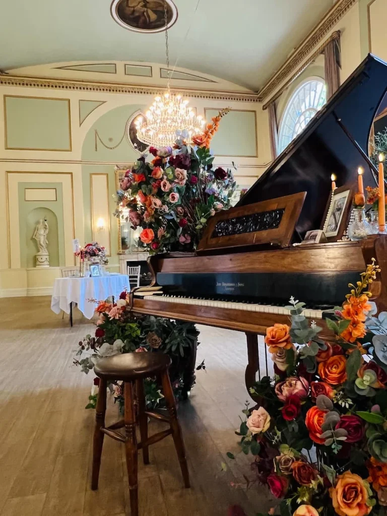 Indian Afternoon Tea At the City Rooms, Grand piano with floral decoration in the ballroom