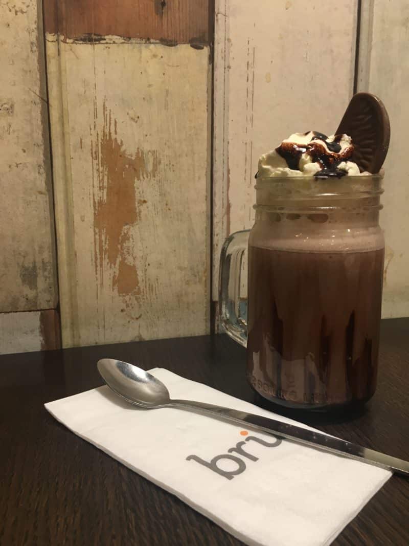 LE1:Coffee & Cake Locales. Bru Coffee and Gelato. Hot chocolate topped with cream and a segment of Terry's chocolate orange.