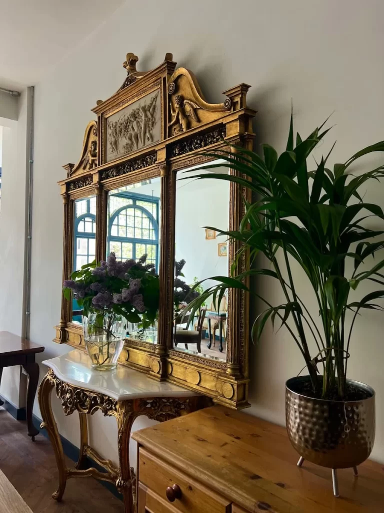 Large gold antique mirror at 5 coats cafe, Leicester