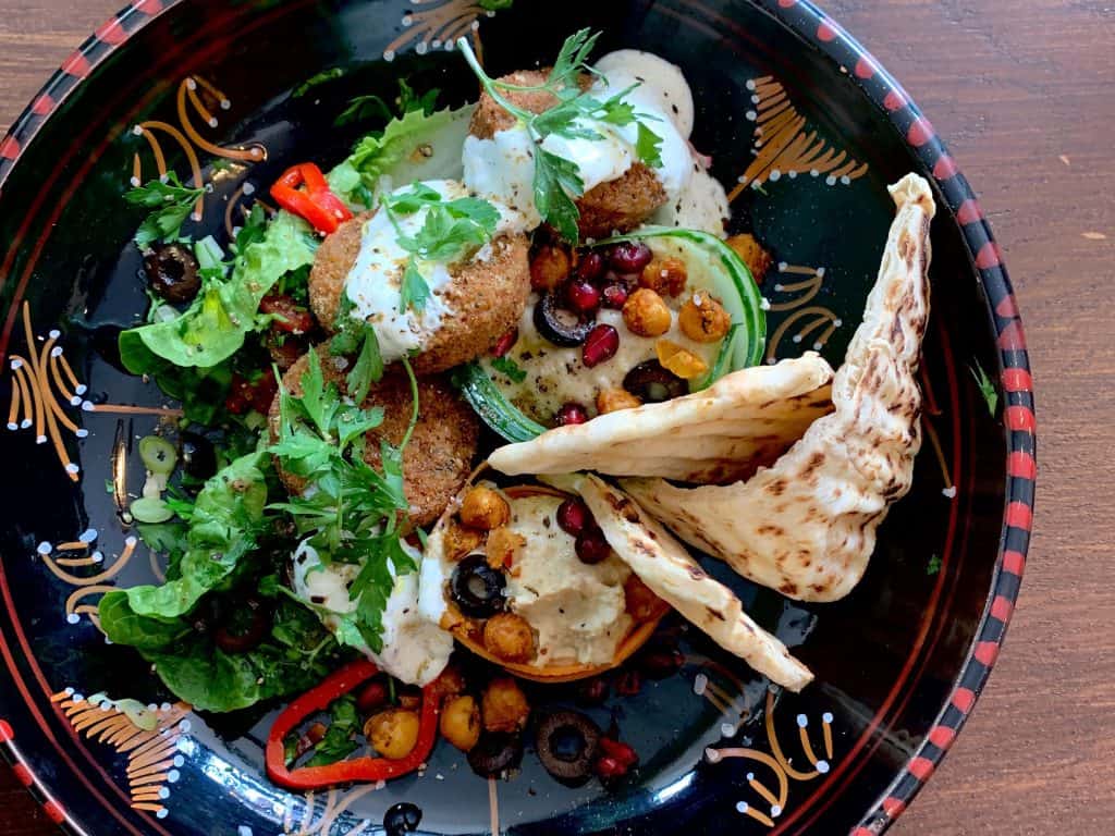 Moroccan colourful salad in a black bowl at La Foret Cafe, Leicester