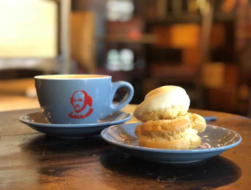 Independent Coffee Shops in LE1, Leicester. Side view of blue cup with latte and an Italian pastry at Merchant of Venice,