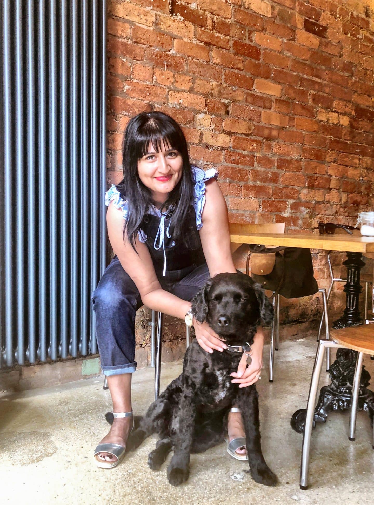 Independent Coffee Shops in LE1, Leicester. Bejal with Tomo, the black dog at Leicester Coffee House Company.