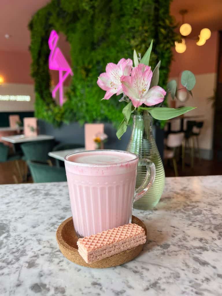 Pink latte with a pink wafer at Audrey, Leicester
