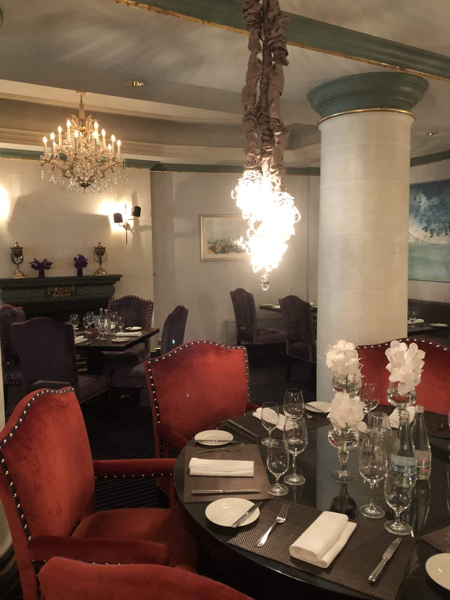The Grand Palace Hotel Riga Pils Restaurant interior wuth hanging chandeliers 