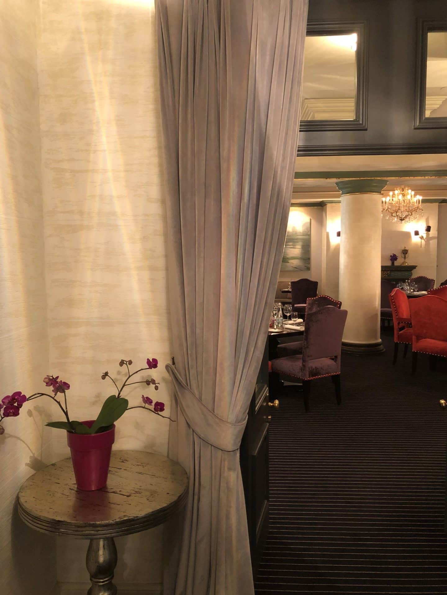 The Grand Palace Hotel Riga curtain peaking into the Pils Restaurant area 