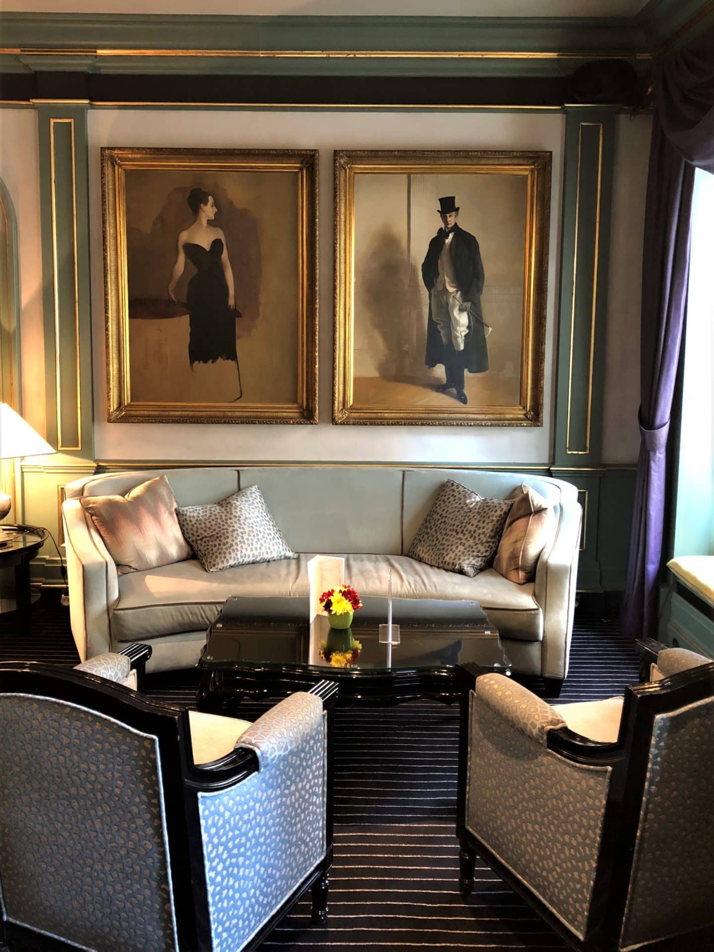 The Grand Palace Hotel Riga sofas and 2 arm chairs in the bar area with 2 paintings on the wall