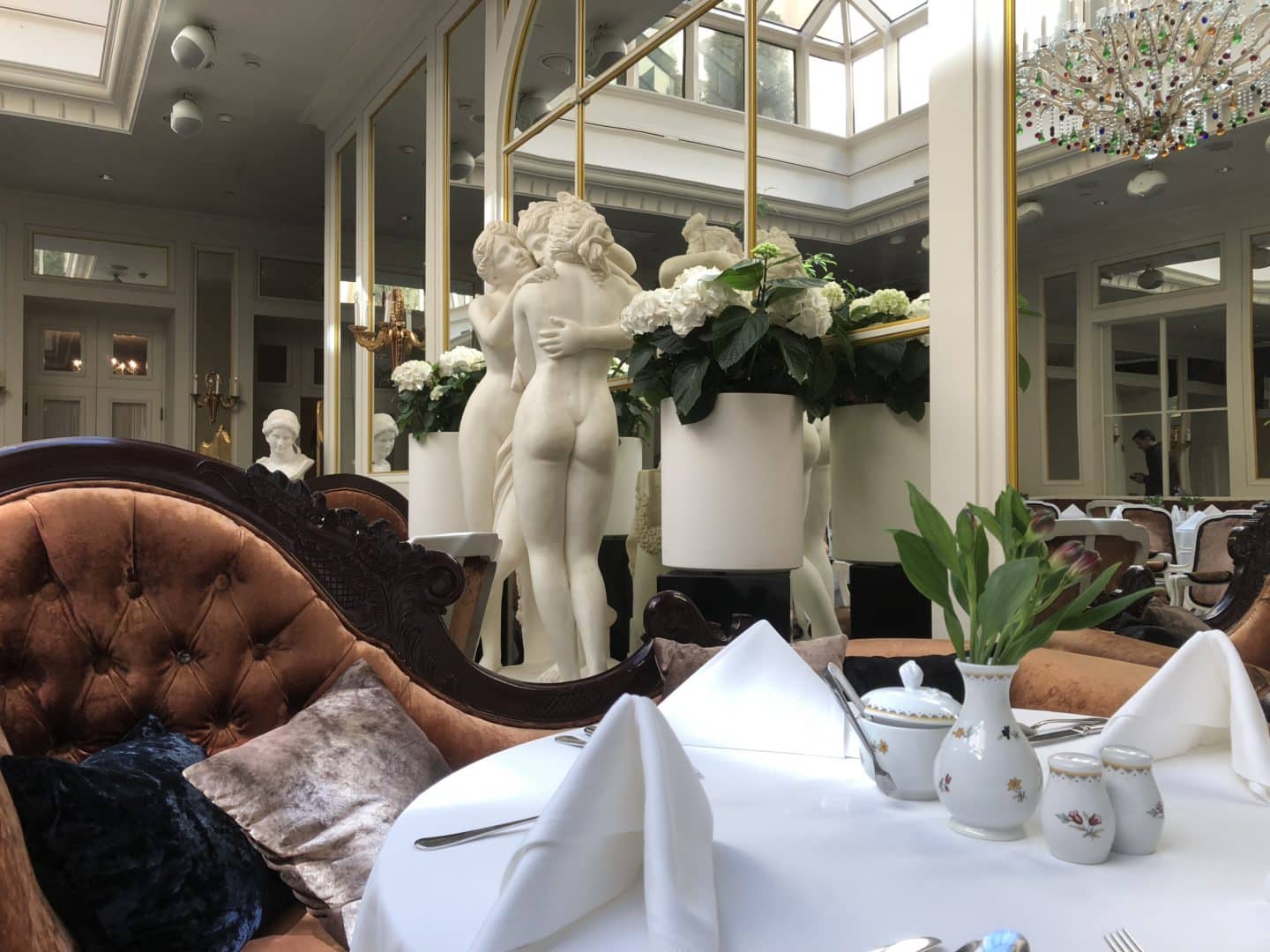 The Grand Palace Hotel Riga Orangery with porcelain cherubs in the background