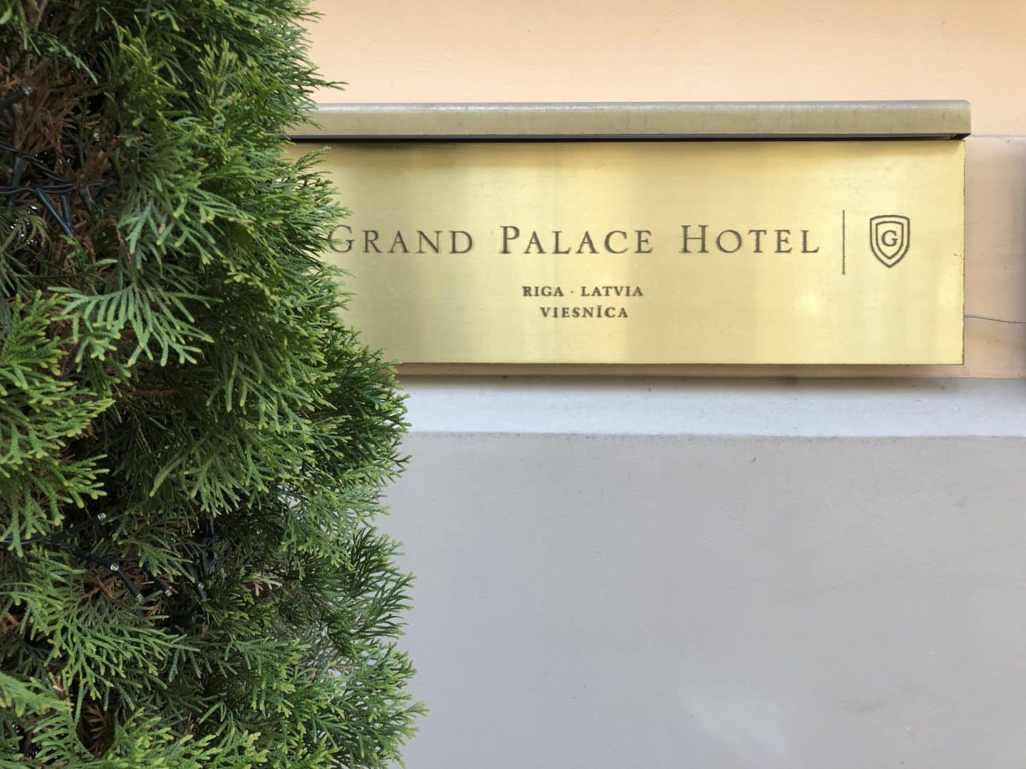 The Grand Palace Hotel Riga gold plaque at entrance