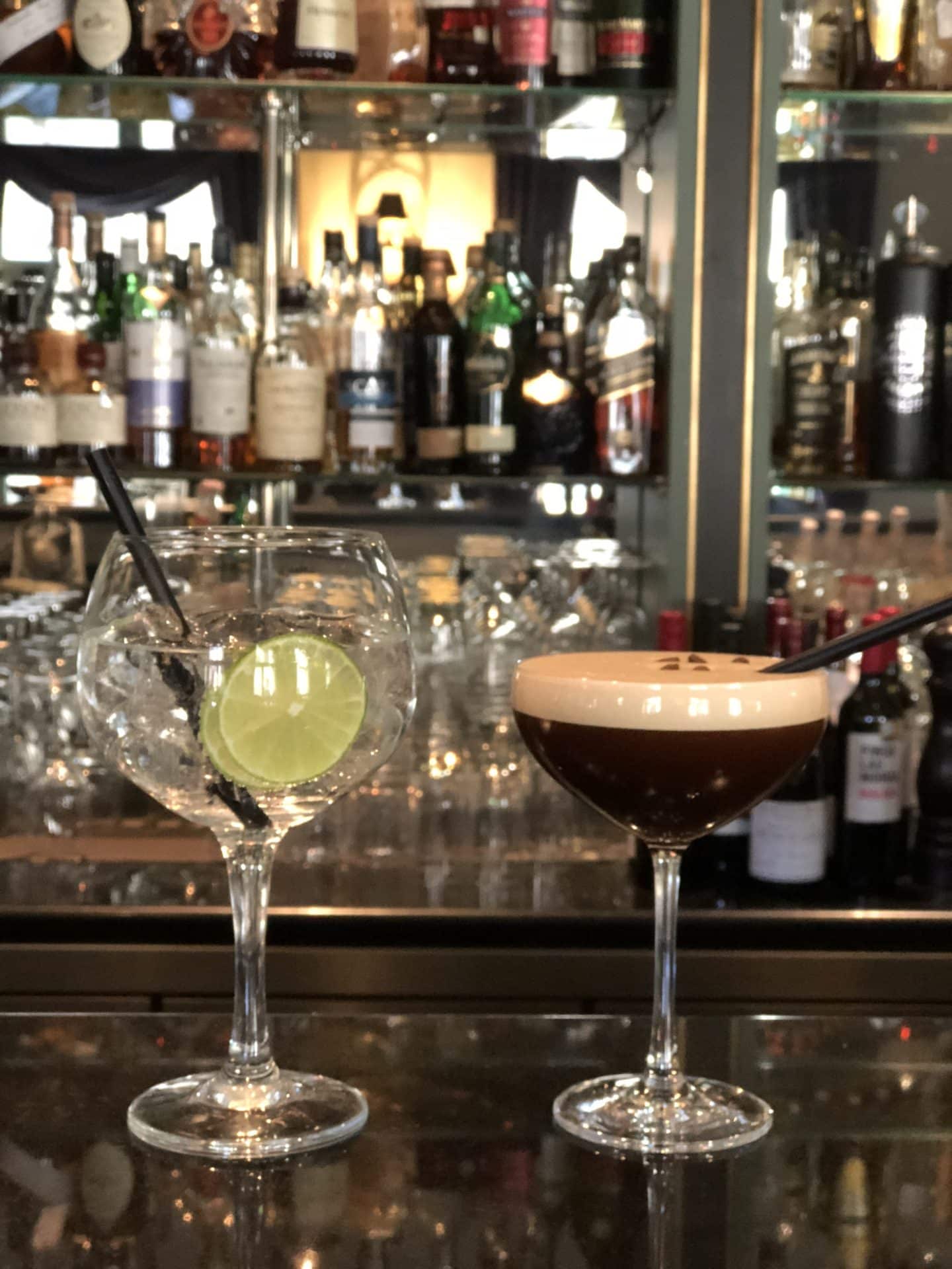 The Grand Palace Hotel Riga Espresso Martini and Gin & Tonic resting on the bar top