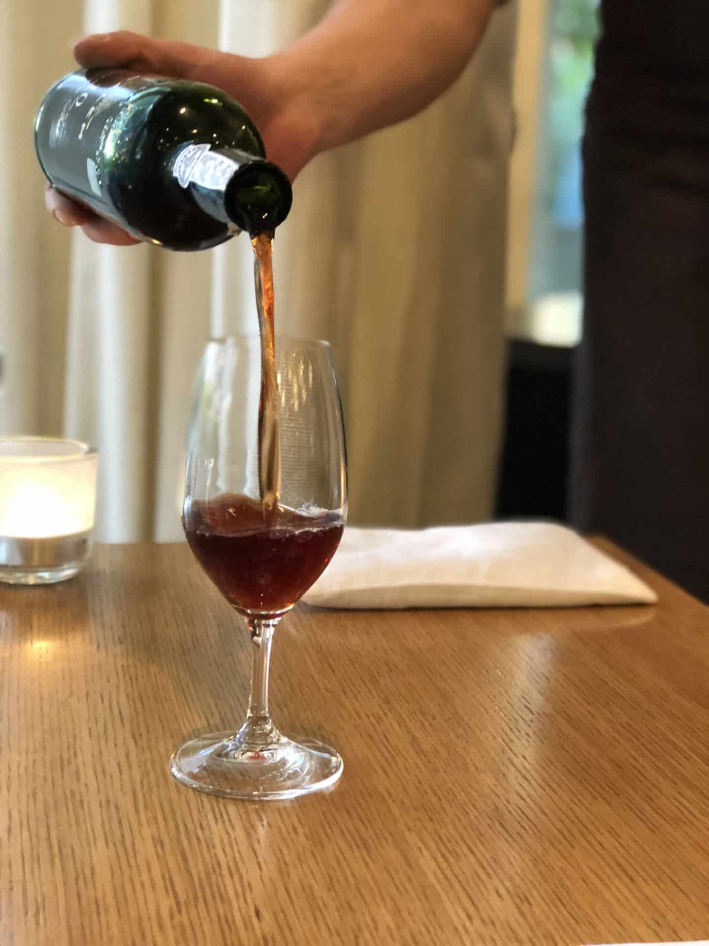 Whitehouse Restorāns wine being poured, 3 dasy in Riga