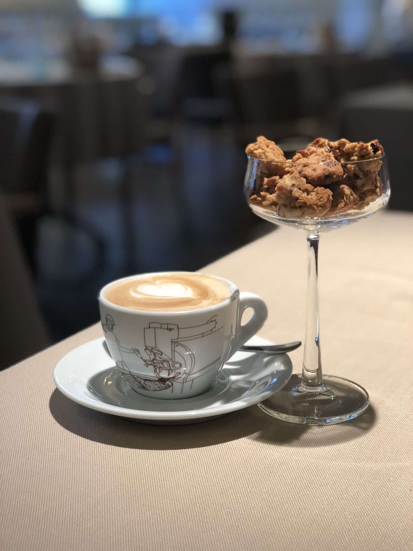 Vegetarian-friendly food in Riga: Coffee and crunchy amoretto biscuits in a cocktail glass and Riviera restaurant in Riga