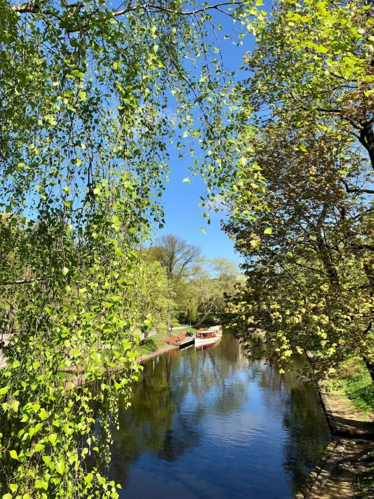 Boat coming down the canal at Bastejkalns Park, Riga