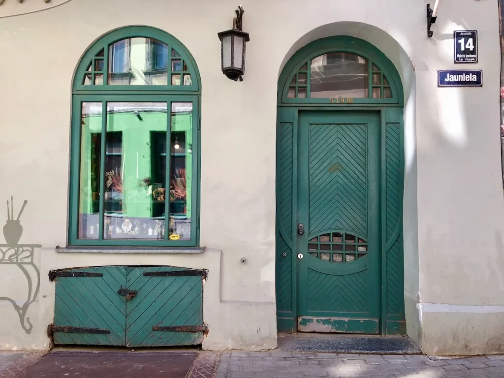 Green facade of an old Medieval house in Riga