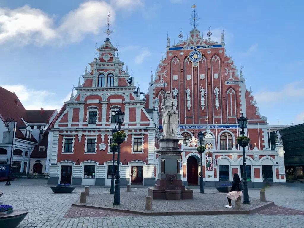 Exterior of the House of the Blackheads with Bejal sitting outside, during 3 days in Riga