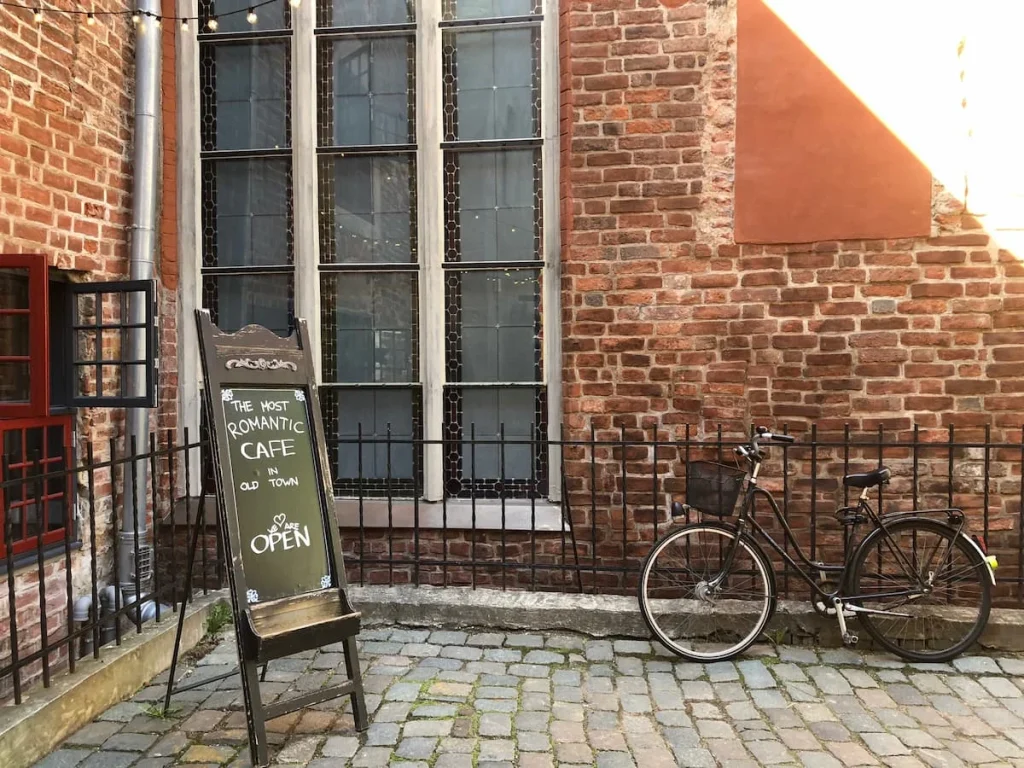 Romantic cafe exterior with a bike outside, Riga