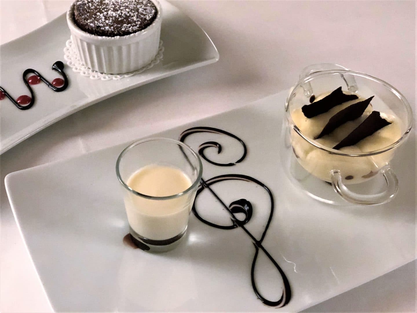 chocolate soufflé with ‘fior di latte’ ice cream and orange scented honey and the traditional Tiramisu