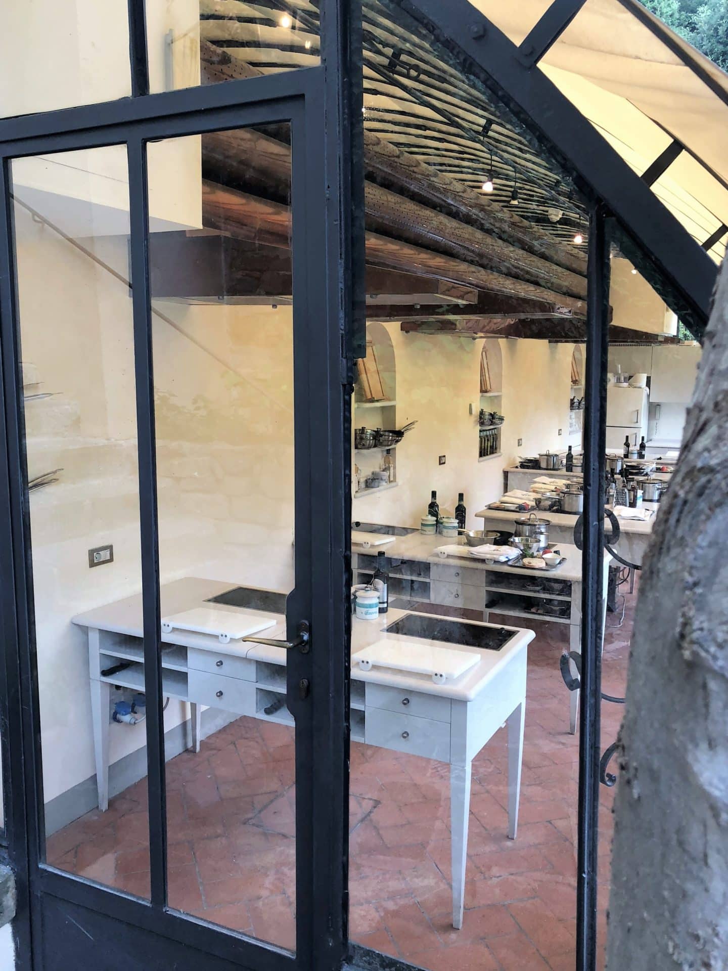 The outside door of the hotels cookery school, looking in to teh individual stations.