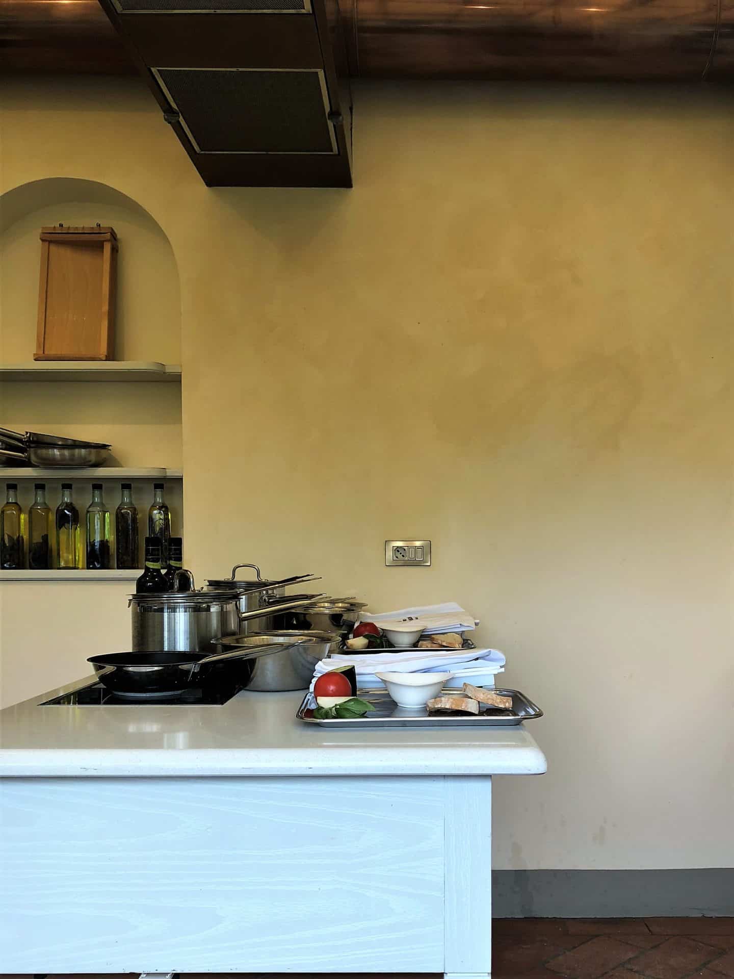 The workstation in the hotels cookery school with appliances laid out ready for a class.