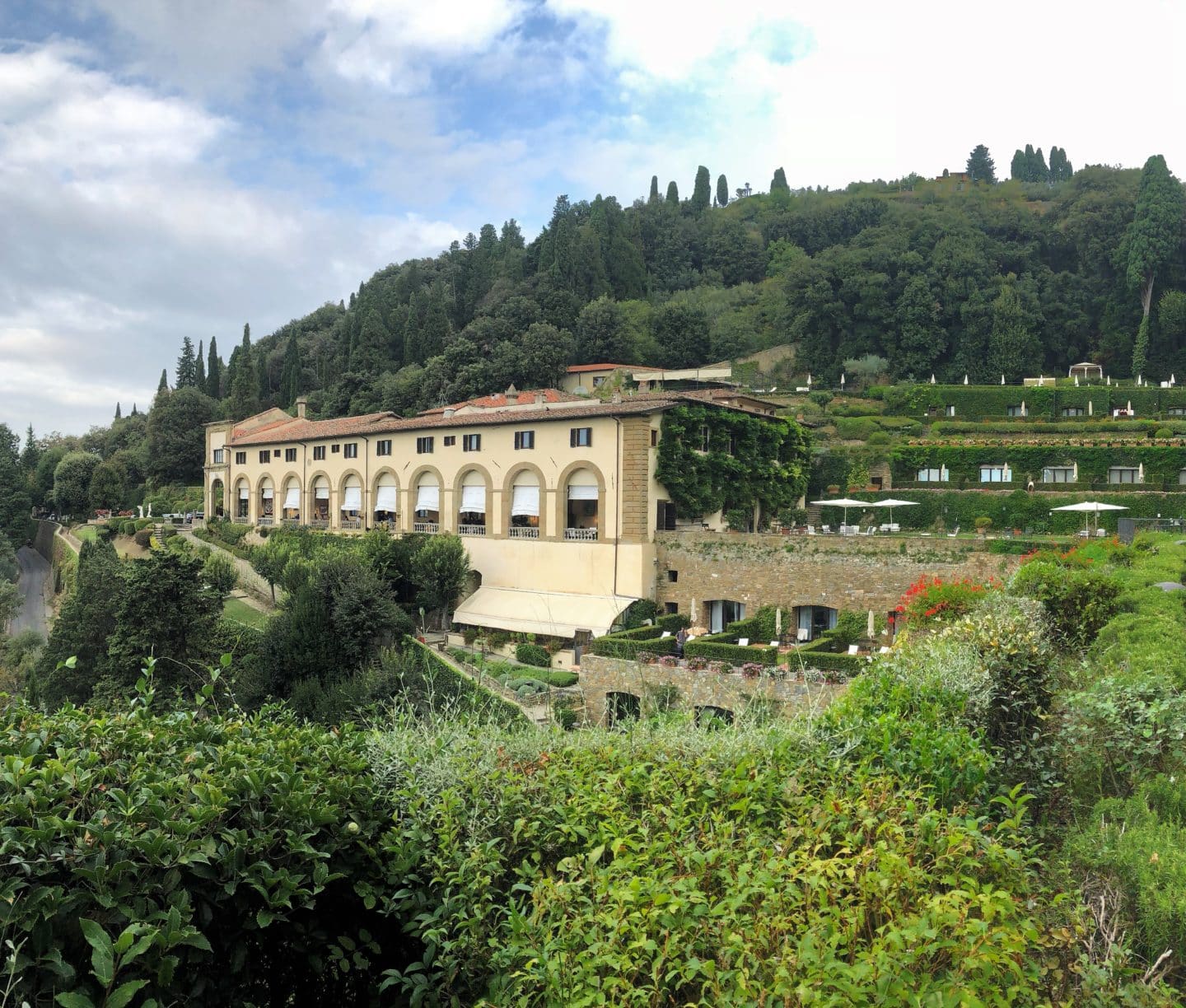 Belmond Villa San Michele: Hotel from a side view with the extensive lush green gardens surrounding the main concent building, 