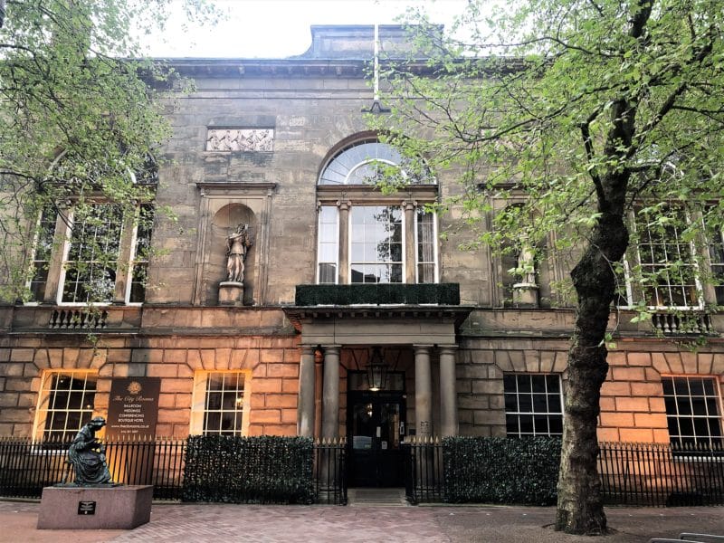 A Locals Guide to Historic Leicester A Locals Guide to Historic Leicester, teh exterior of the City Rooms with uplighting to make the stone Georgian exterior of teh building stand out