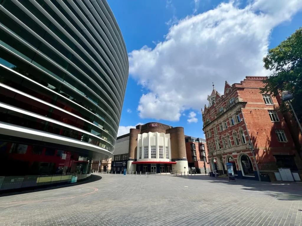 Orton Square in the Cultural Quarter of Leicester. The Curve theatre is on the left with Athena in the centre and Queens Building to the right.