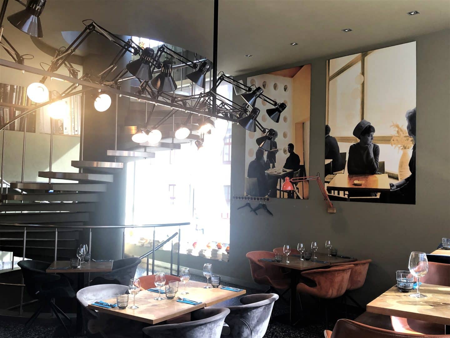 Vegetarian food in Tallinn, interiors of Pegasus restaurant with open cafe space and down lighting