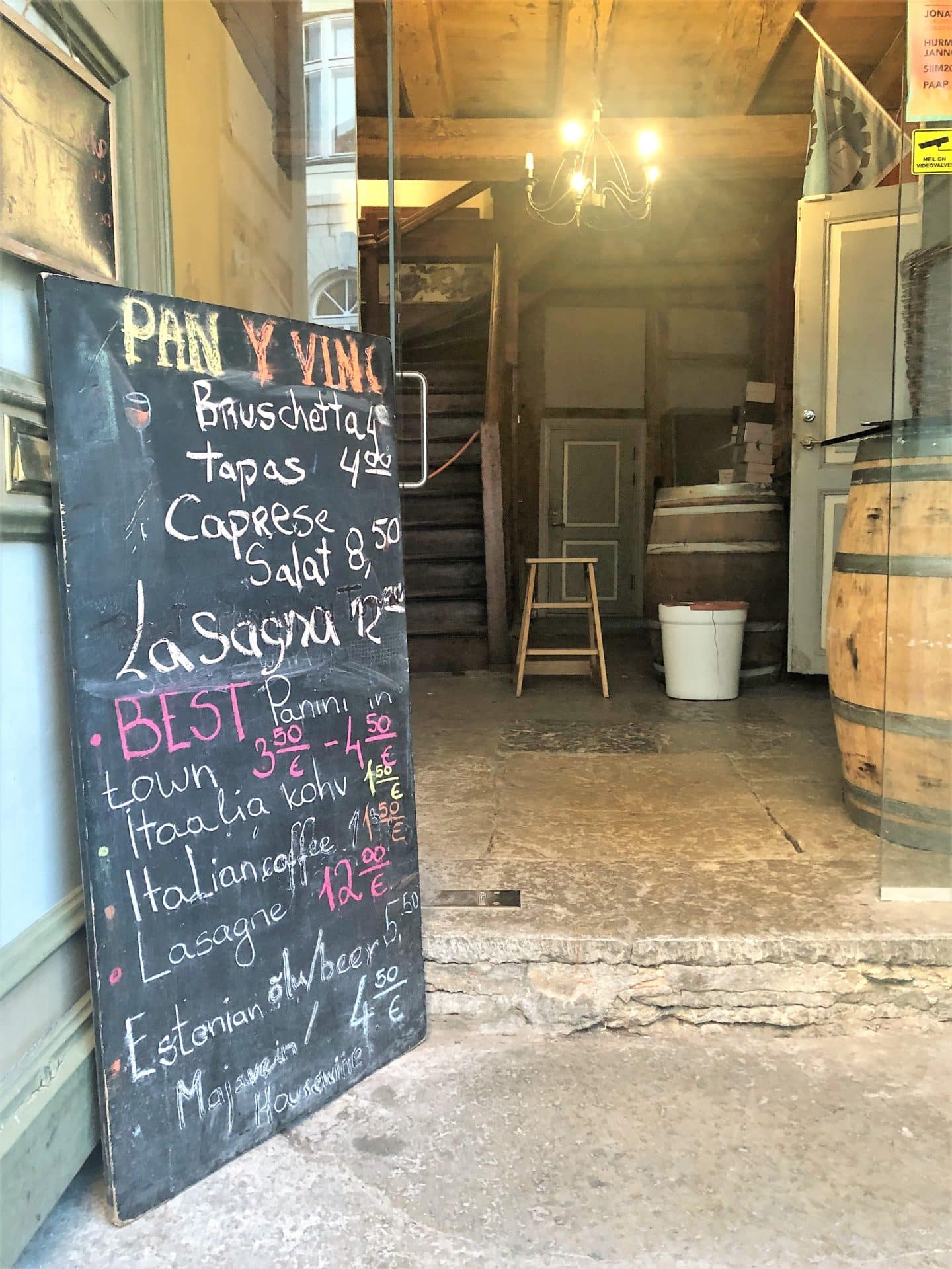 The menu chalk board in the entrance of Pan Y Vino in Tallinn with drinks and small plates written in colourful chalk