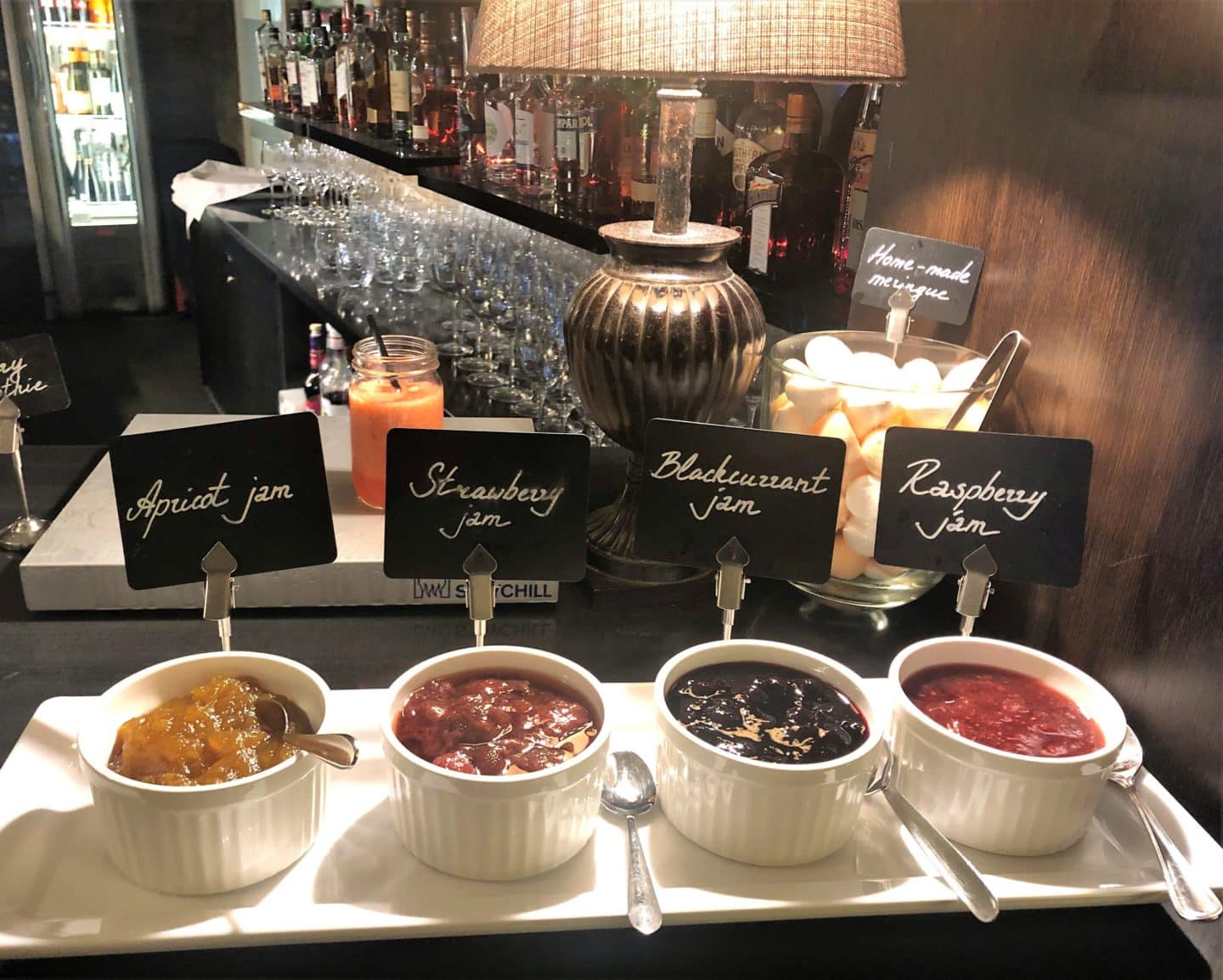 The Schlossle Hotel Tallinn: four white ramekins of conserves and ramekins at the Stenhus Restaurant 