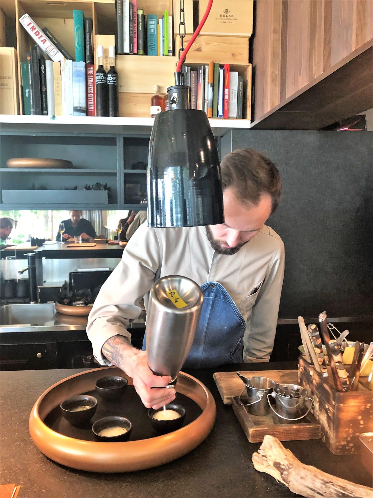 Chef Roman making the foam for the fermented celeriac lemonade with verbena at Noa Chef's Hall, Tallinn