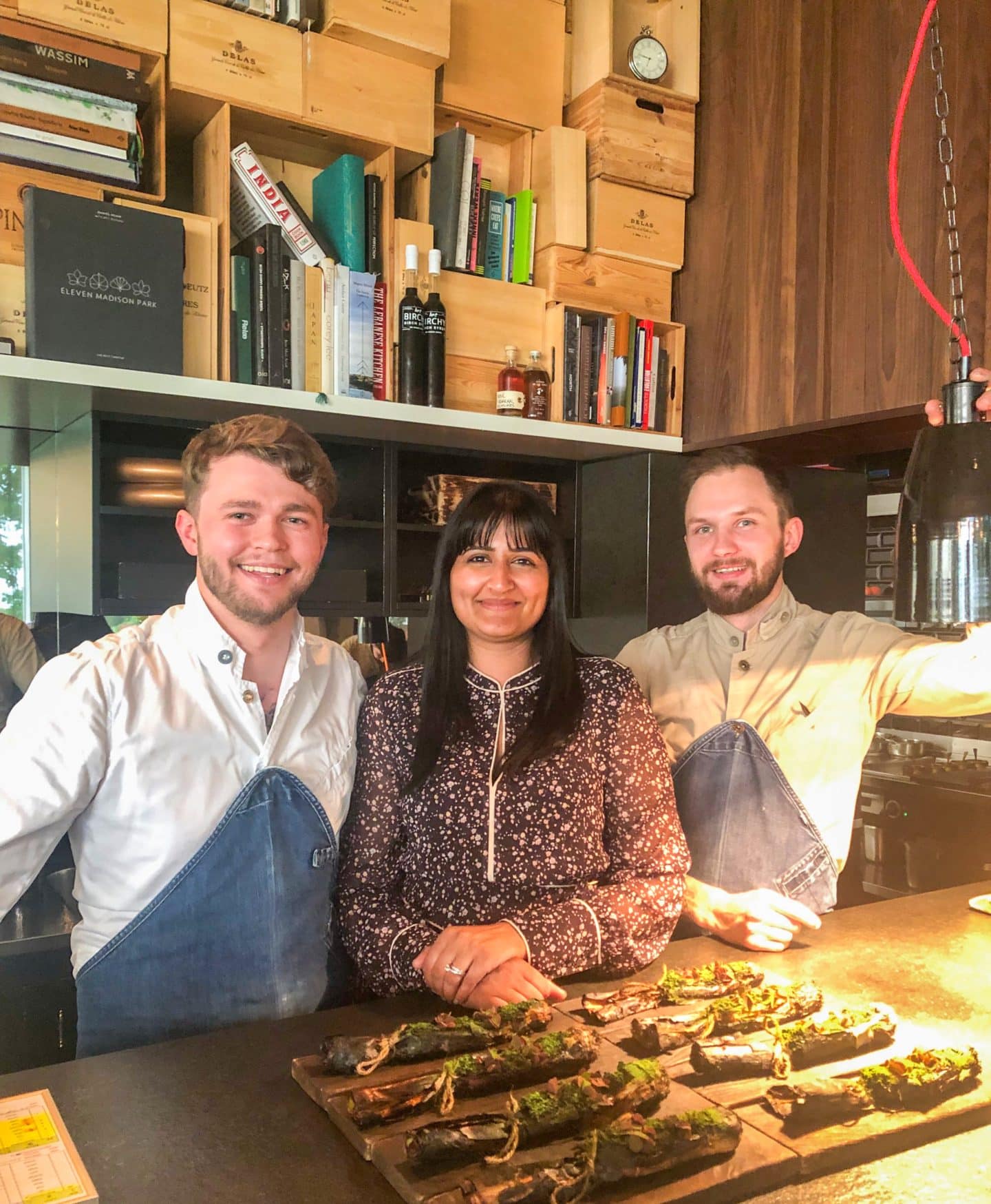 Head chef Orm, Bejal and sous chef, Roman posing for a photo at the chef's counter of Noa Chef's Hall, Tallinn