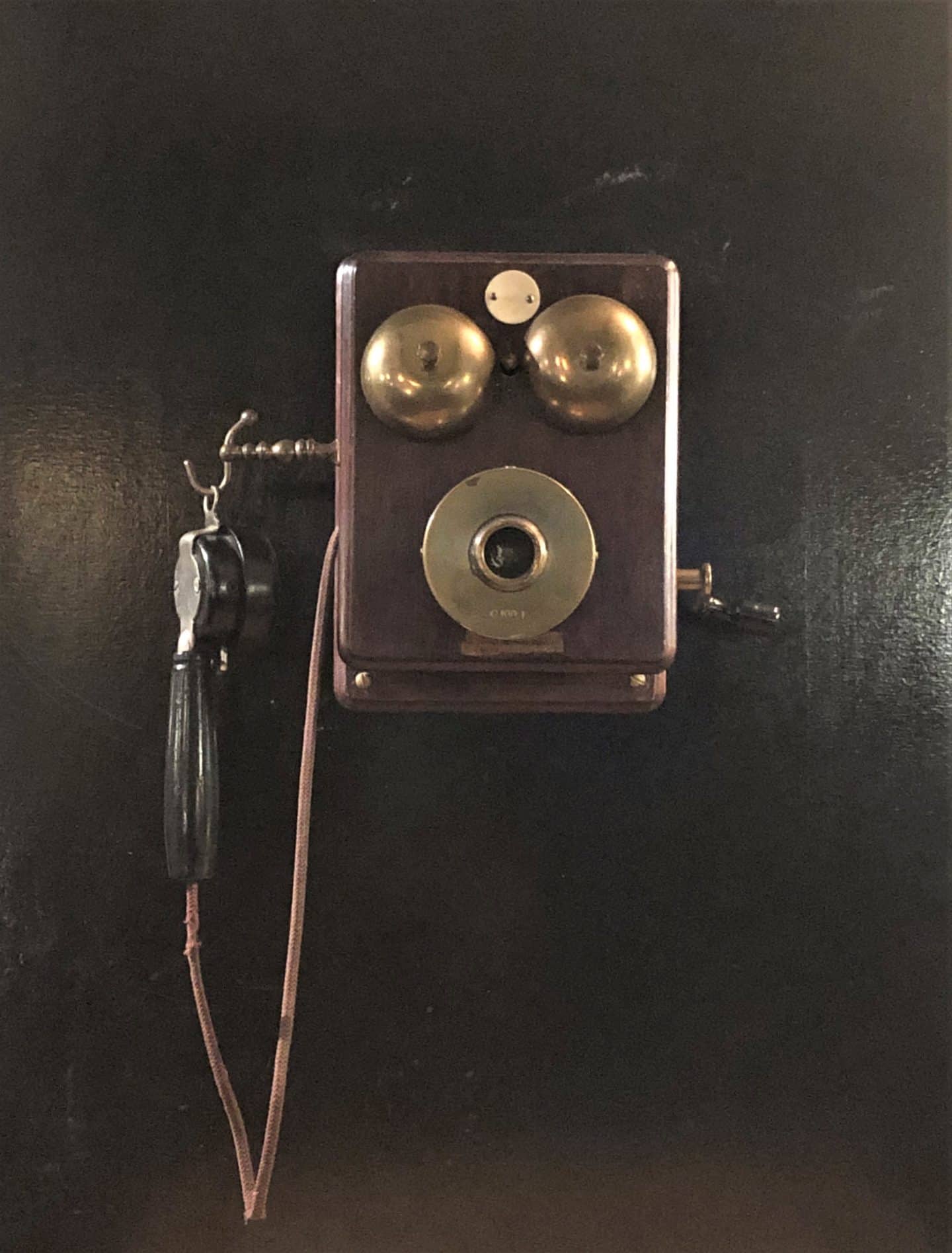 An old style telephone in Frank Underground, Tallinn against the black wall