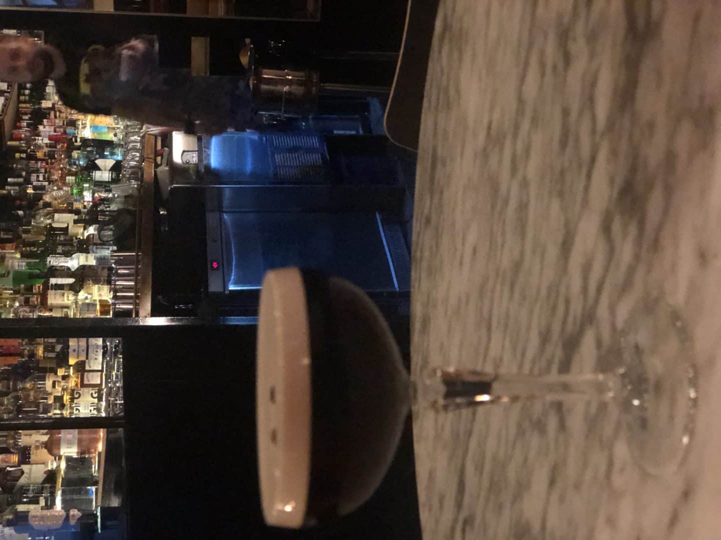 An Espresso Martini at Frank Underground bar in Tallinn with the bar area in the background