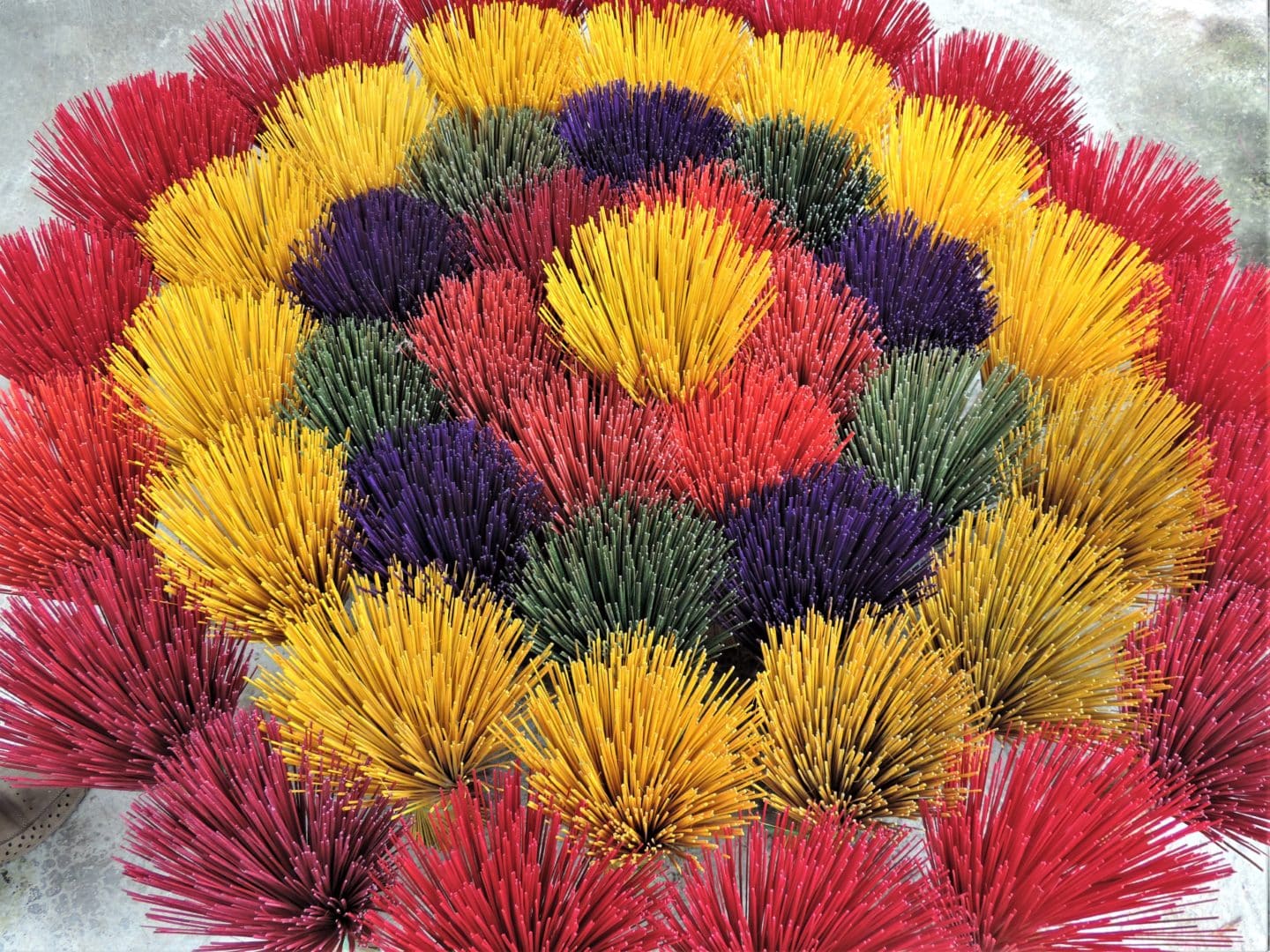 Vietnam in 14 days incense in different colours arranged in a pretty circular pattern, Hue