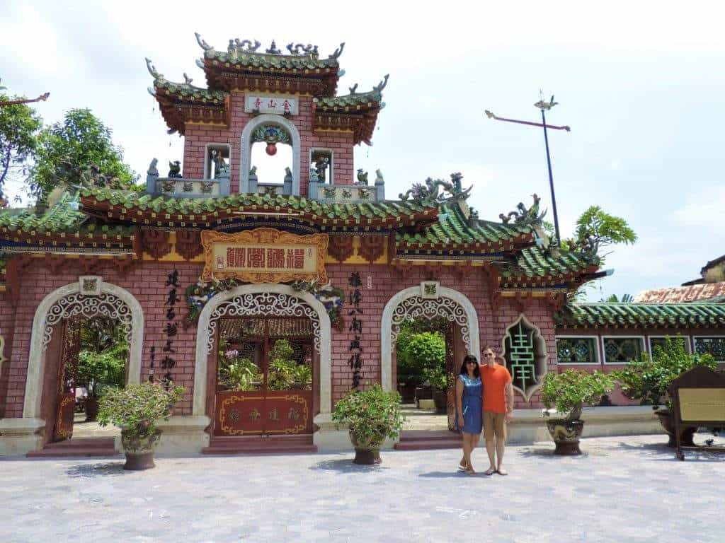The Chinese Congregation Exterior in Hoi An with Bejal & Dr C standing outside the ornate brick structure