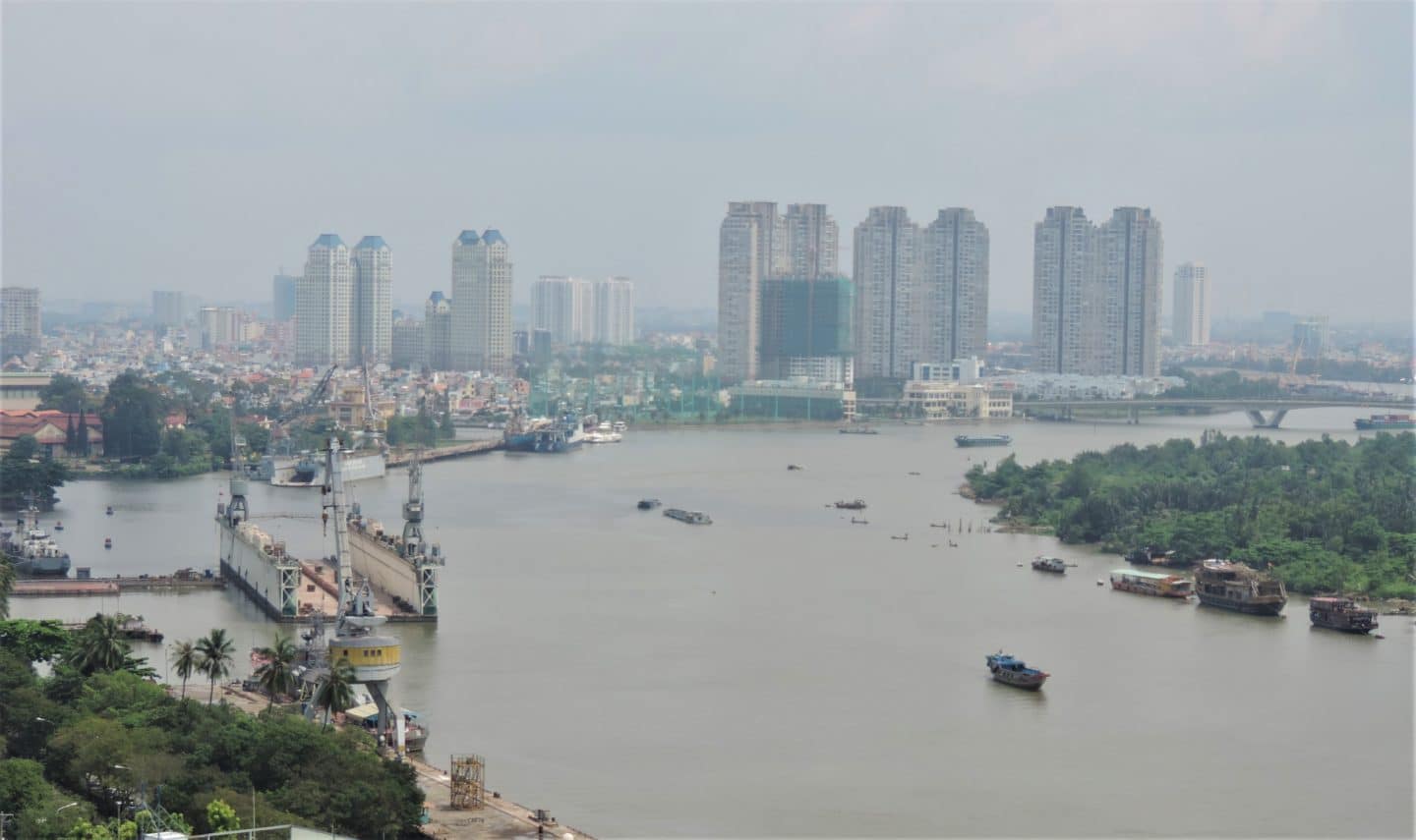 Grand Hotel Saigon bedroom views of the Ho Chi Minh City skyline