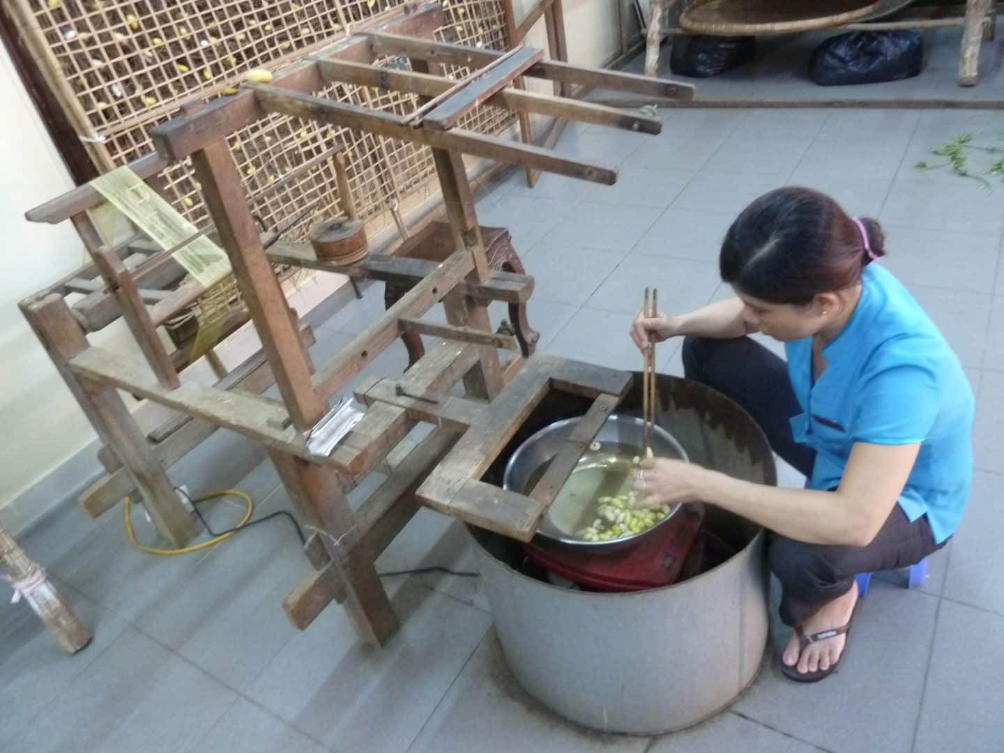 Lady making silk in Hoi An