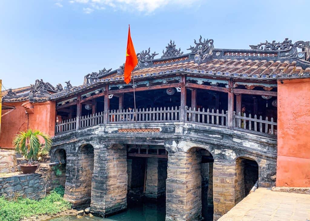 Japanese Covered Bridge, Hoi An with teh red and gold Vietnamese flag on the outside 