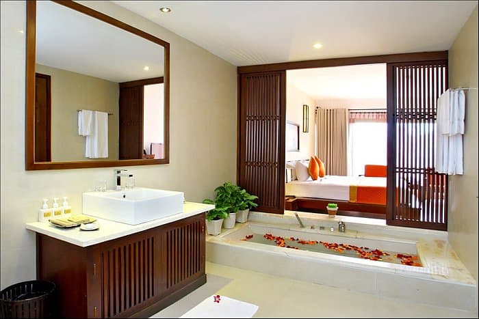 14 days in Vietnam: Palm Garden Beach Resort bungalow interiors with a sunken bath filled with flower petals, Hoi An