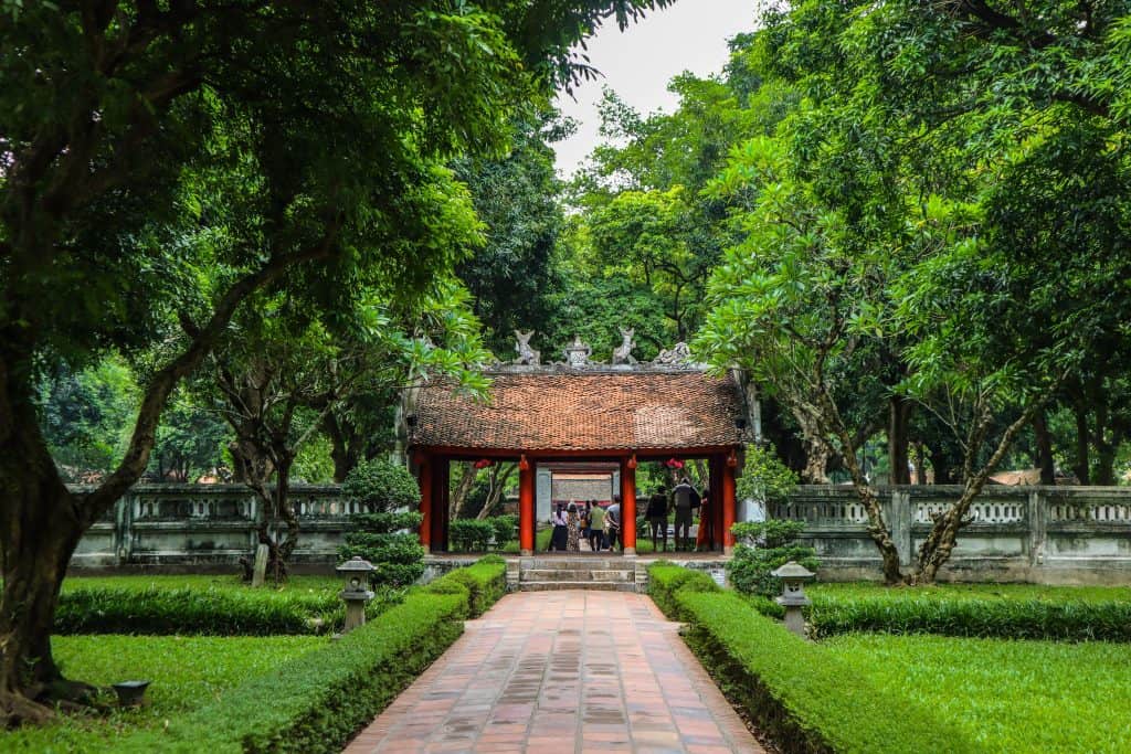 Vietnam in 14 days: The temple of Literature, Hanoi surrounded by pruned gardens and green foliage.
