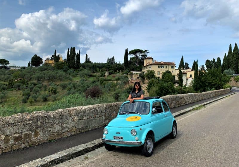 Fiat 500 from Florence with Bejal standing in the Fiat car.