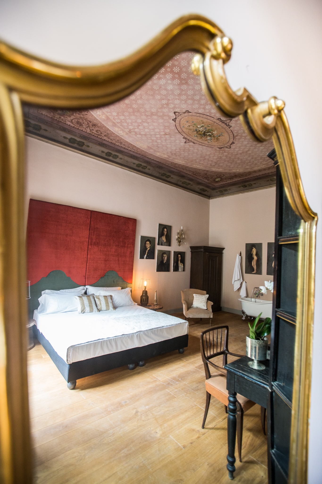 Soprarno Suites: A Beautiful Boutique Hotel in Florence, reflection of room in gold rimmed mirror