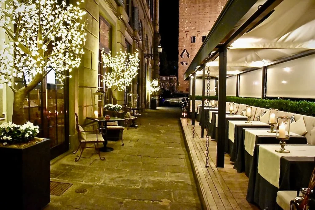 Michelin Starred Dining at Bottega del Buon Caffe, Florence Exterior of La Bottega del Buon Caffe lit up with fairy lights in Florence