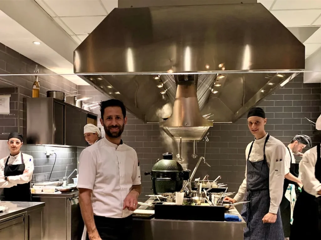 The open kitchen with all the staff at La Bottega del Buon Caffe, Florence