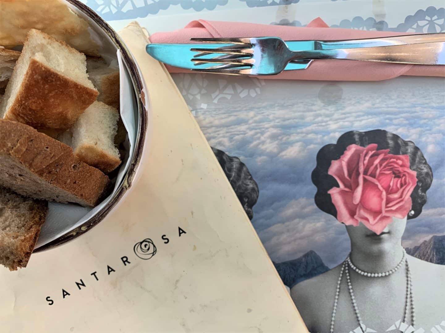 Bowl of bread with cutlery at Santarosa Bistrot. vegetarian-friendly food in Florence.